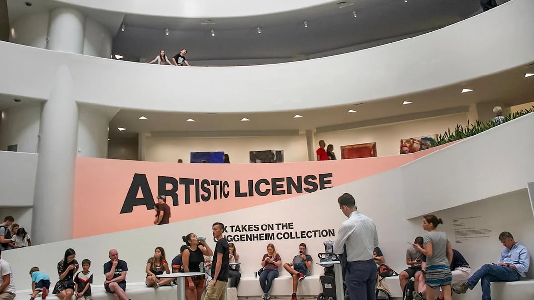 Visitors inside the Guggenheim Museum, New York, near the "Artistic License" exhibit.