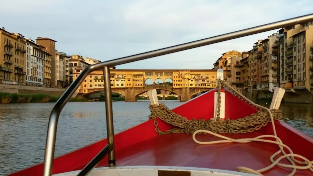 Gondola view of Ponte Vecchio on a guided boat tour in Florence.