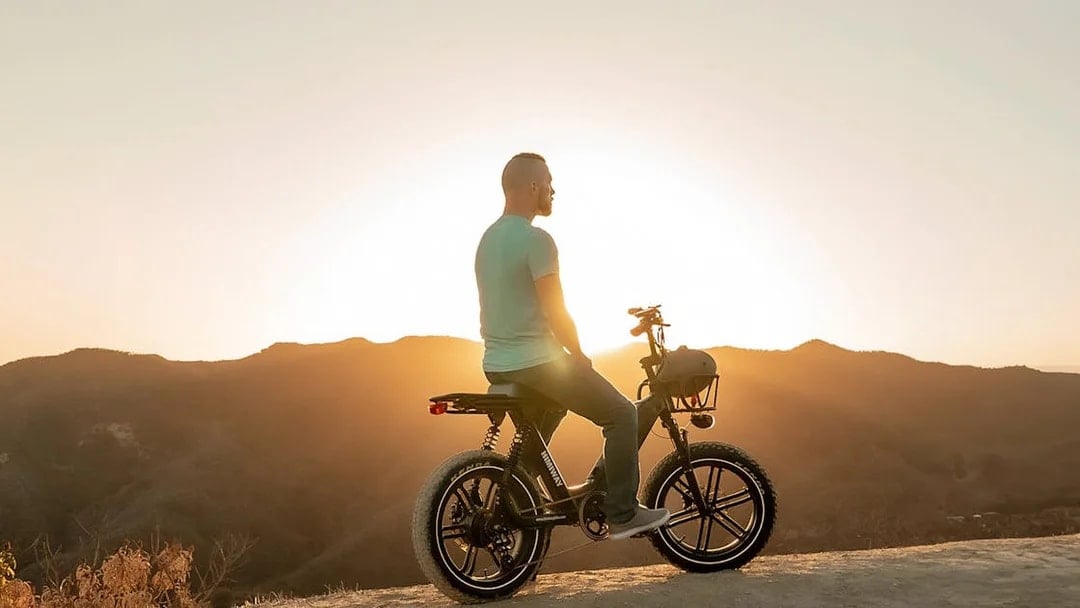 eBiker enjoying Chianti sunset view on a hilltop.