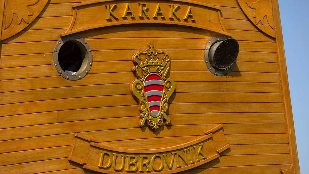 Karaka ship detail with Dubrovnik emblem for Elaphite Islands cruise.