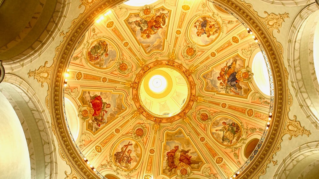 Frauenkirche dome with intricate frescoes during guided gallery tour.