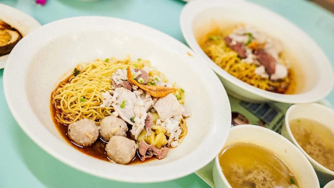 Noodle dish with meatballs and broth on a Guided Michelin and Local Hawker Food Tour.