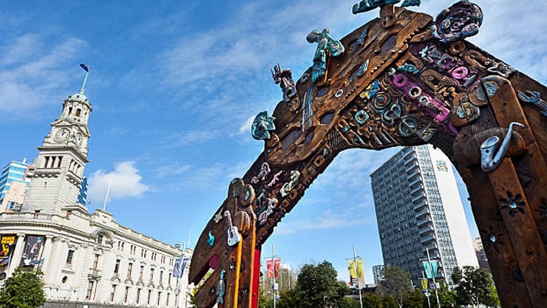 Auckland Town Hall and colorful archway on a guided walking tour.