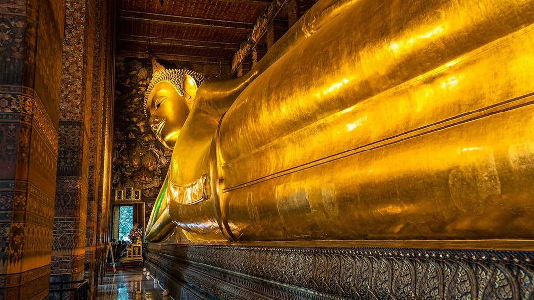 Reclining Buddha statue at Wat Pho, Bangkok, part of Grand Palace and temples tour.