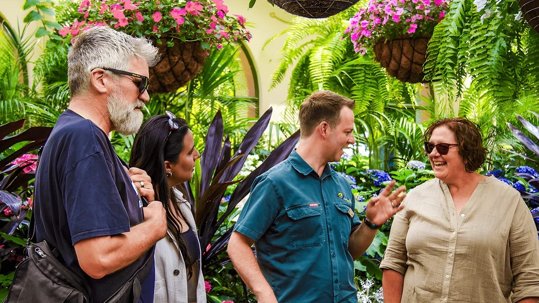 Visitors enjoying a guided tour in the Conservatory at Fitzroy Gardens, Melbourne.