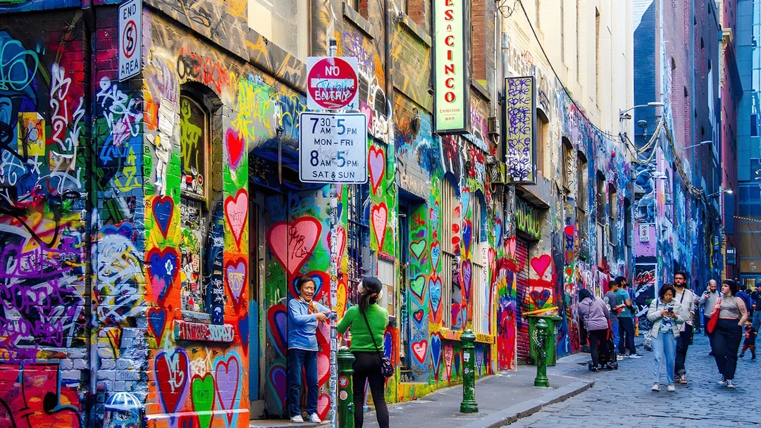 Visitors exploring vibrant street art on Hosier Lane, Melbourne.