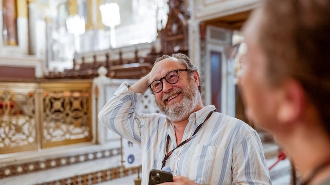 Man enjoying a guided tour inside Palazzo Dei Normanni, Palermo.