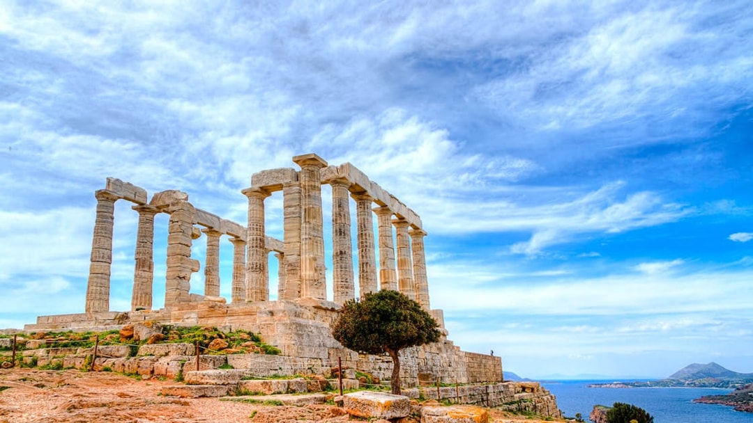 Temple of Poseidon at Cape Sounion with sea view, part of guided tour from Athens.