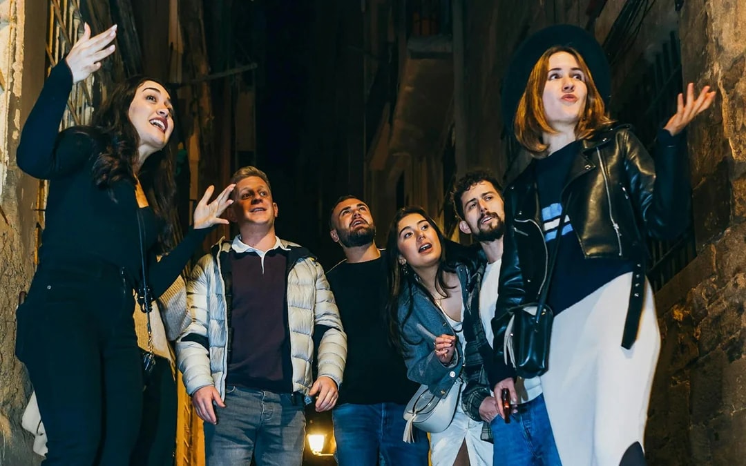 Group exploring narrow street on Barcelona walking tour.