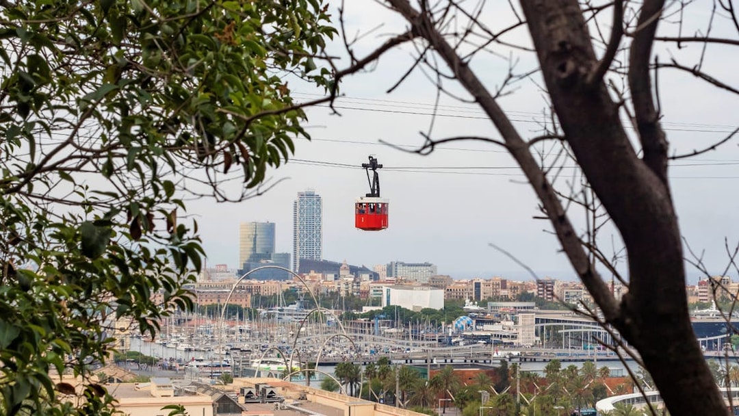 Cable car over Barcelona skyline during Montjuïc walking tour.