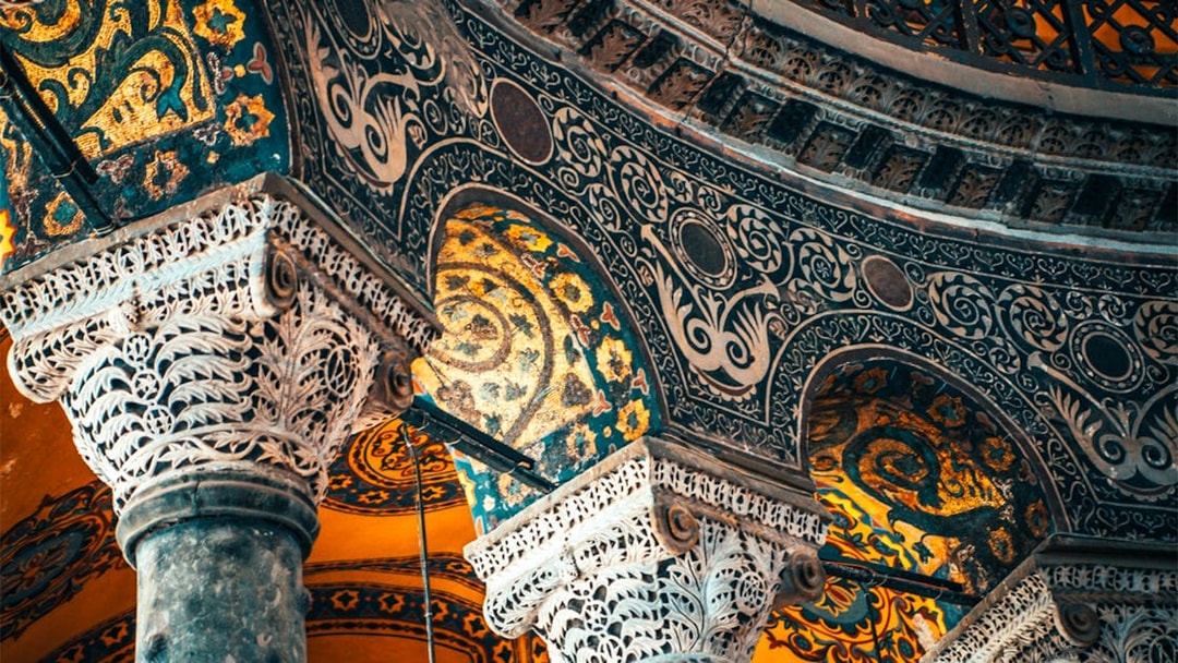 Hagia Sophia interior with ornate columns and intricate mosaics, Istanbul, Turkey.