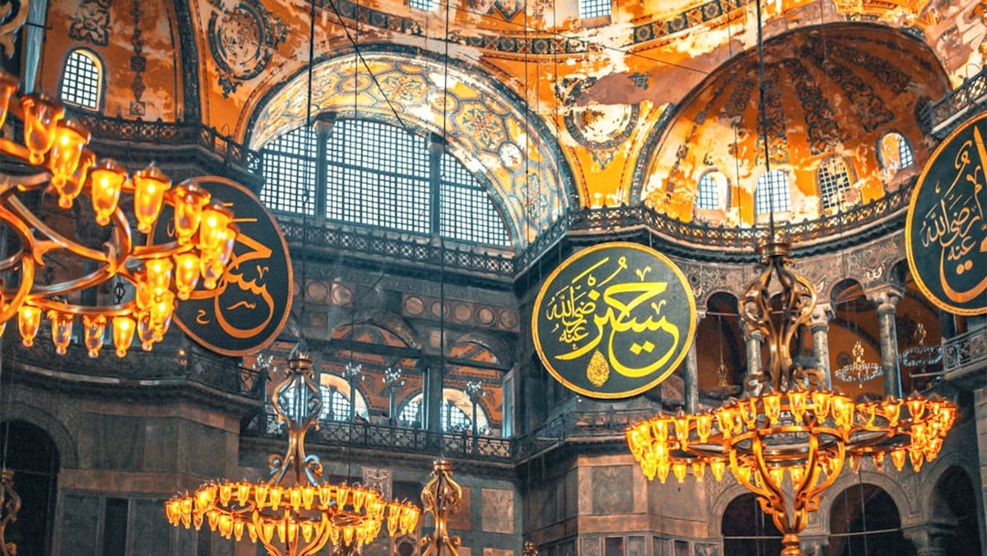 Hagia Sophia interior with chandeliers and Arabic calligraphy, Istanbul.