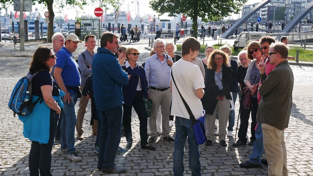 Group listening to a guide during Elbphilharmonie tour in Hamburg.