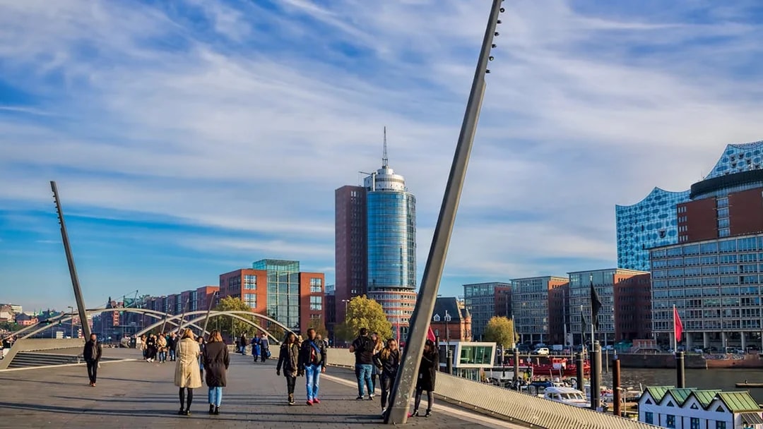 People walking near Elbphilharmonie in Hamburg on a guided tour.