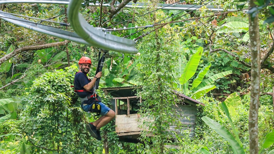 Ziplining through lush jungle at Hanuman World, Phuket.