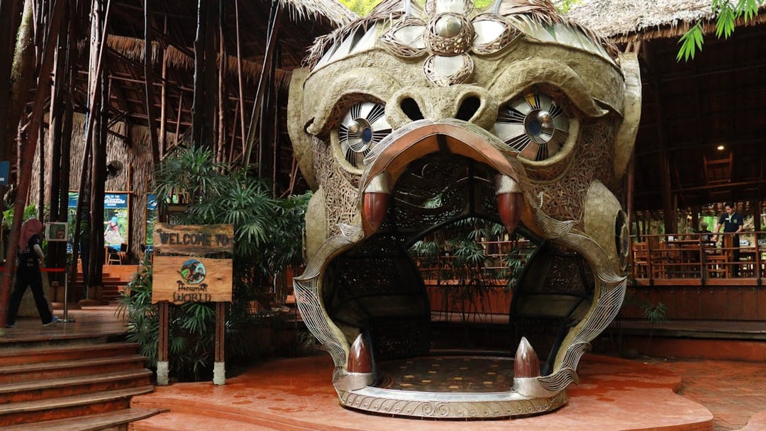 Entrance sculpture at Hanuman World, Phuket, featuring a large ornate monkey head.