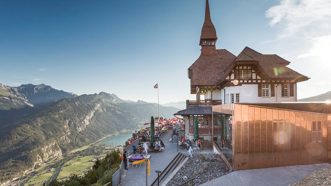 Funicular station at Harder Kulm with panoramic view of Swiss Alps and Lake Thun.
