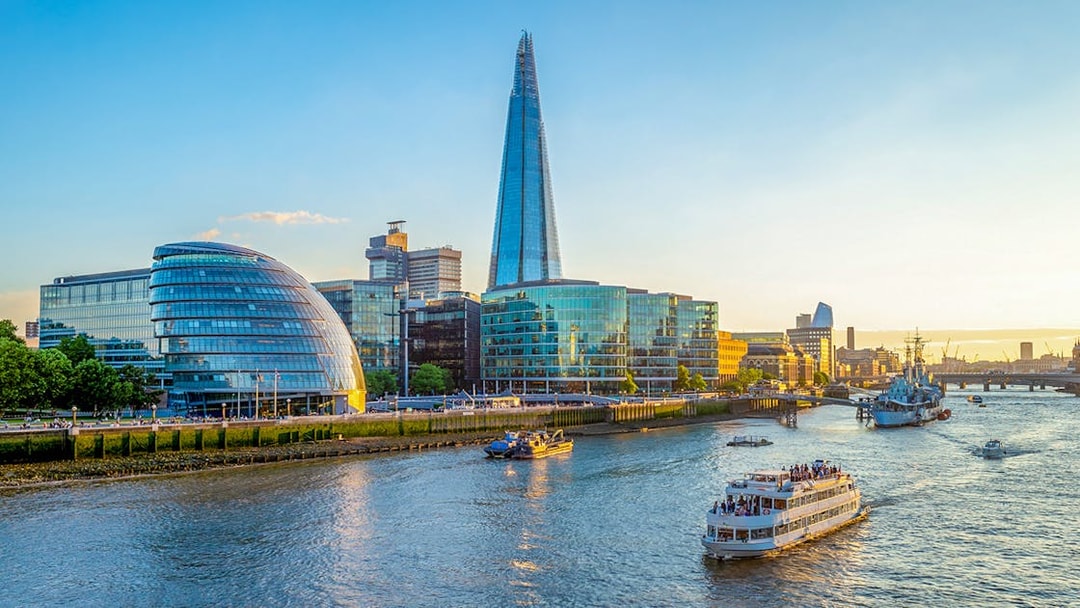 River Thames cruise with view of The Shard and City Hall in London.