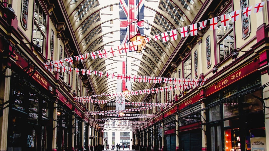 Borough Market arcade with flags, part of Harry Potter film locations tour in London.