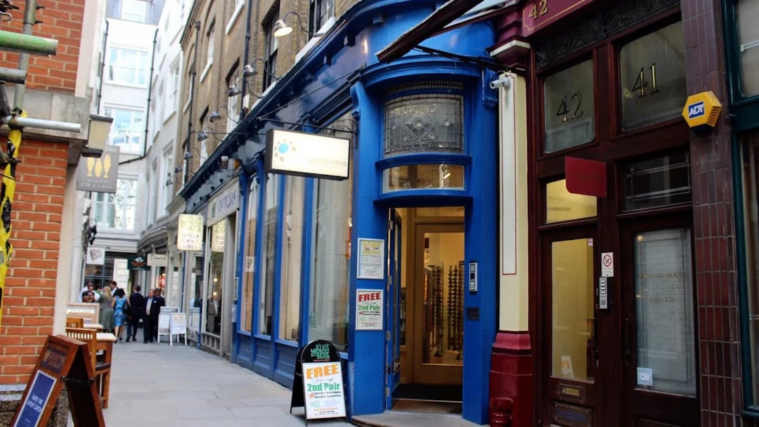 London alleyway with blue storefront, featured in Harry Potter film locations tour.