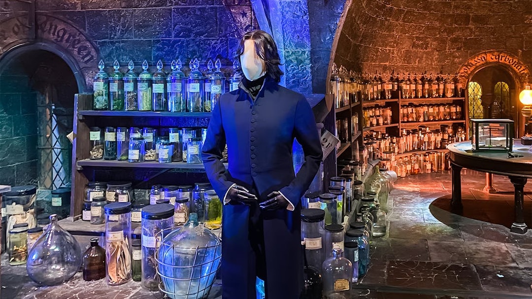 Mannequin in wizard costume at potion room, Harry Potter London tour exhibit.