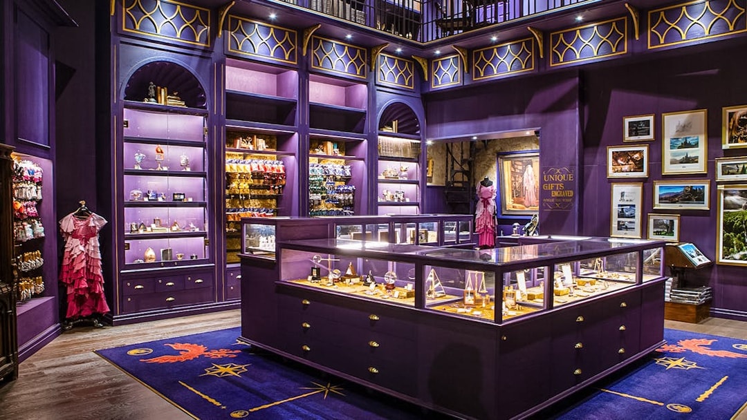 Harry Potter studio shop in London with purple displays and merchandise.