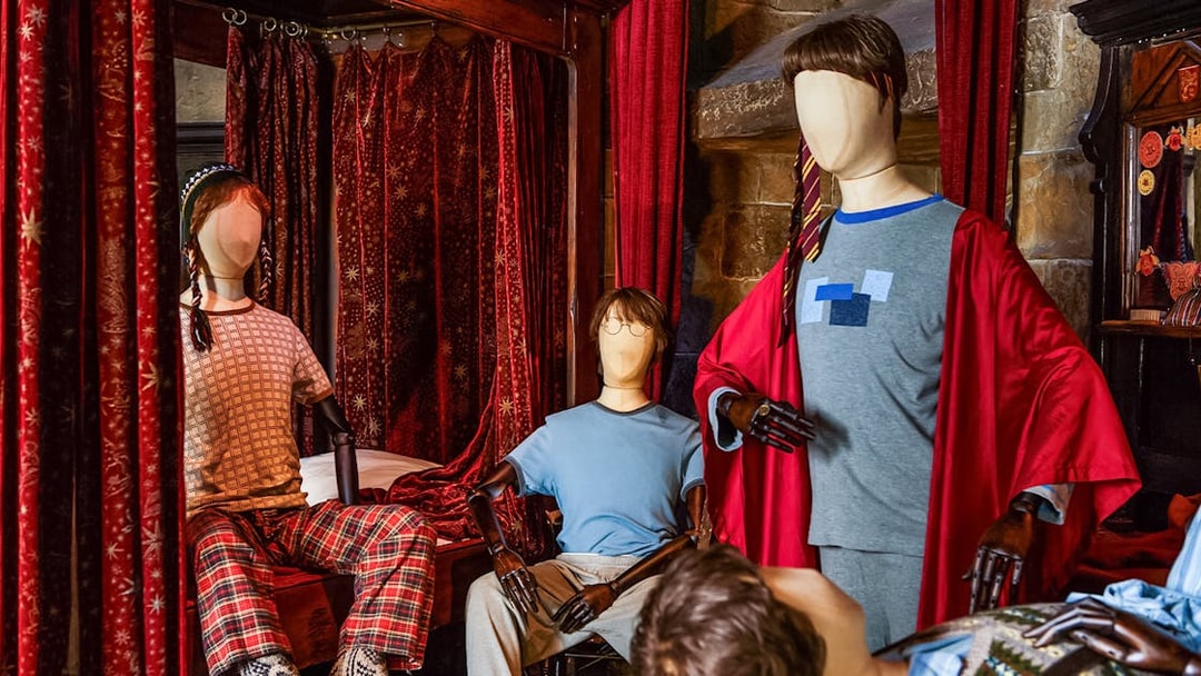 Mannequins in wizard attire at the Magical Mischief exhibit.