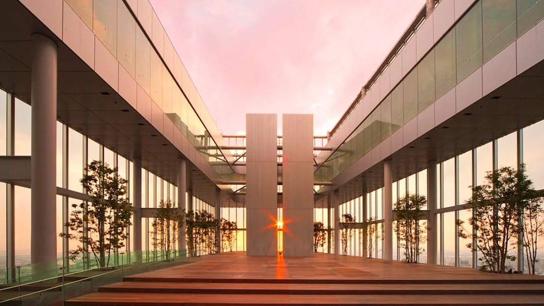 Harukas 300 Observatory interior with sunset view through glass walls.