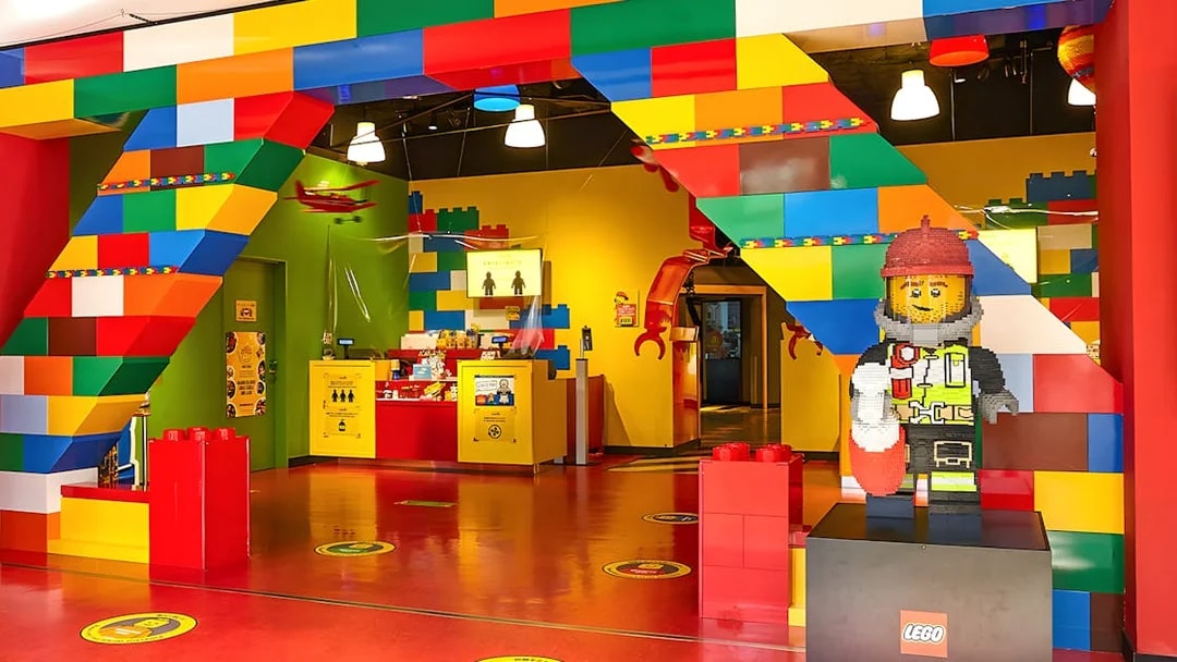 Entrance of Legoland Kansai with colorful Lego arch and firefighter Lego figure.