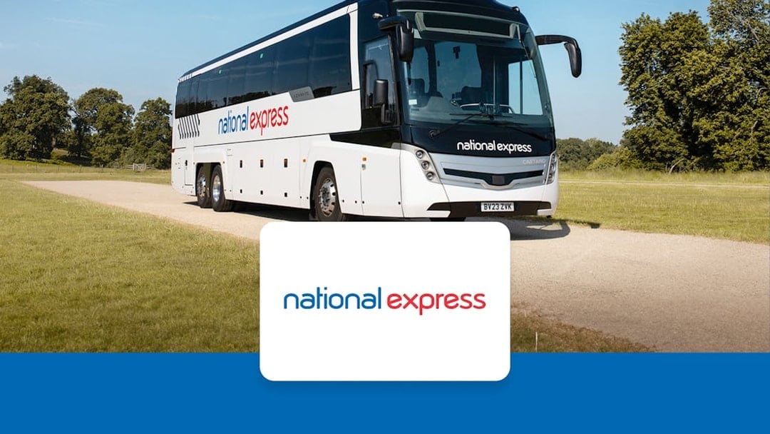 National Express coach on a rural road, offering one-way tickets from Heathrow to London Victoria.
