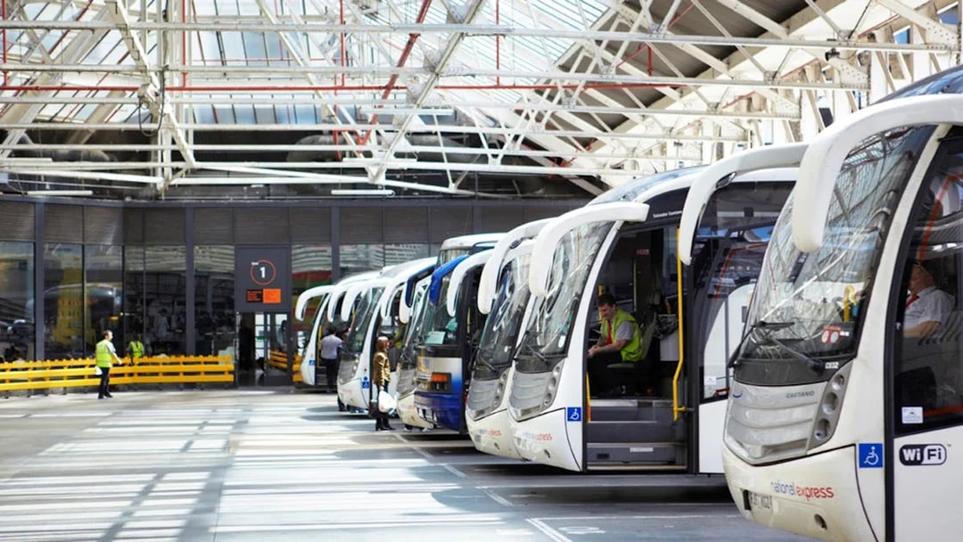 Coaches lined up at a station, ready for one-way trips from Heathrow Airport to London Victoria.
