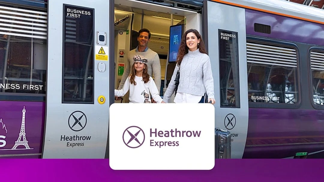 Passengers exiting Heathrow Express train at London Paddington station.