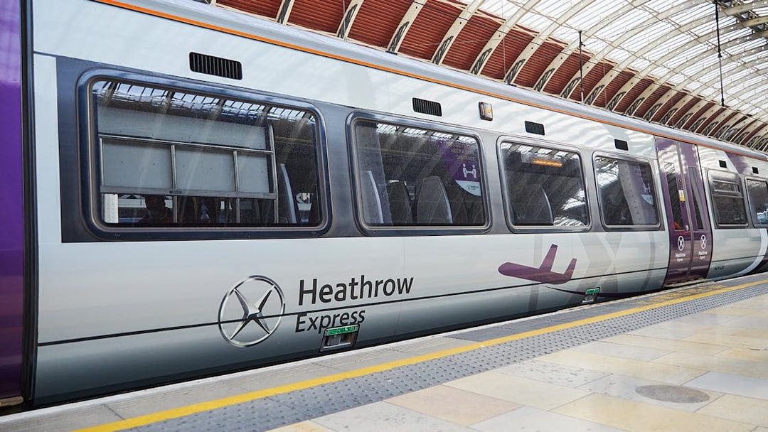 Heathrow Express train at London Paddington station platform.