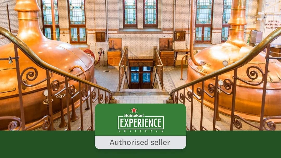 Heineken Experience interior with copper brewing tanks and stained glass windows in Amsterdam.