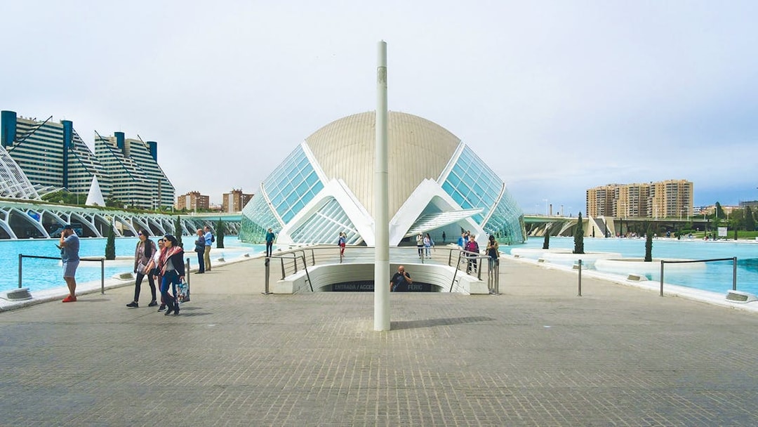 Hemisfèric building with visitors at City of Arts and Sciences, Valencia.