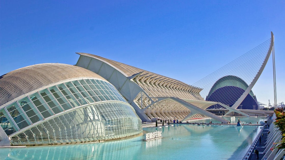 Hemisfèric building in Valencia, Spain, with its distinctive dome and surrounding water.