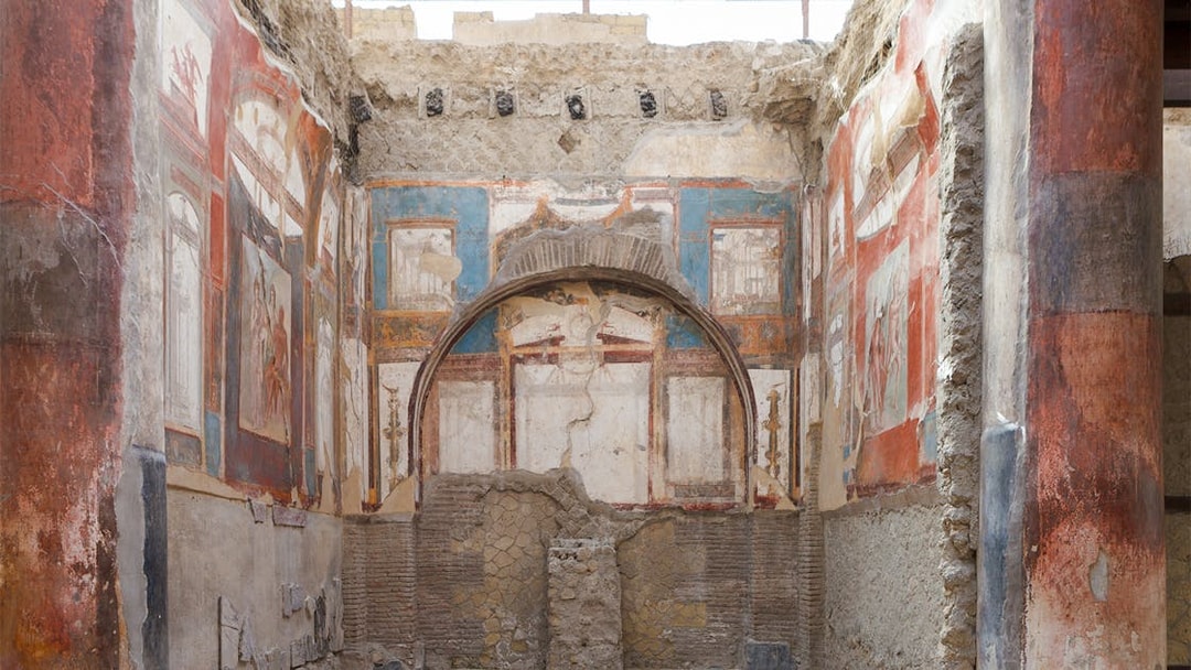 Ancient frescoes and ruins inside a building in Herculaneum, Italy.