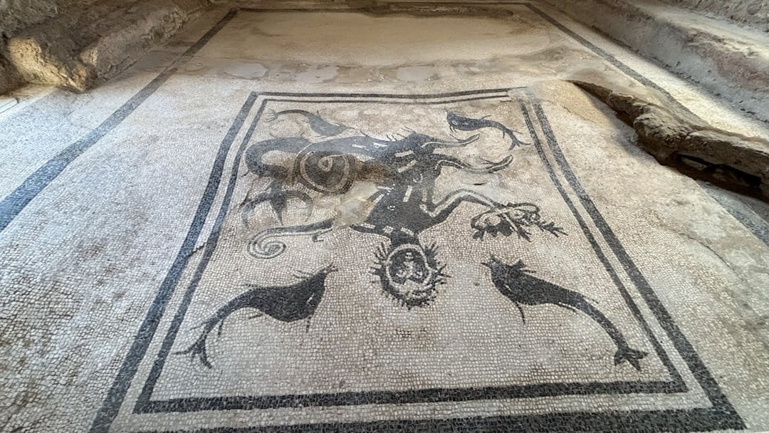 Herculaneum mosaic depicting marine life and mythological figures.