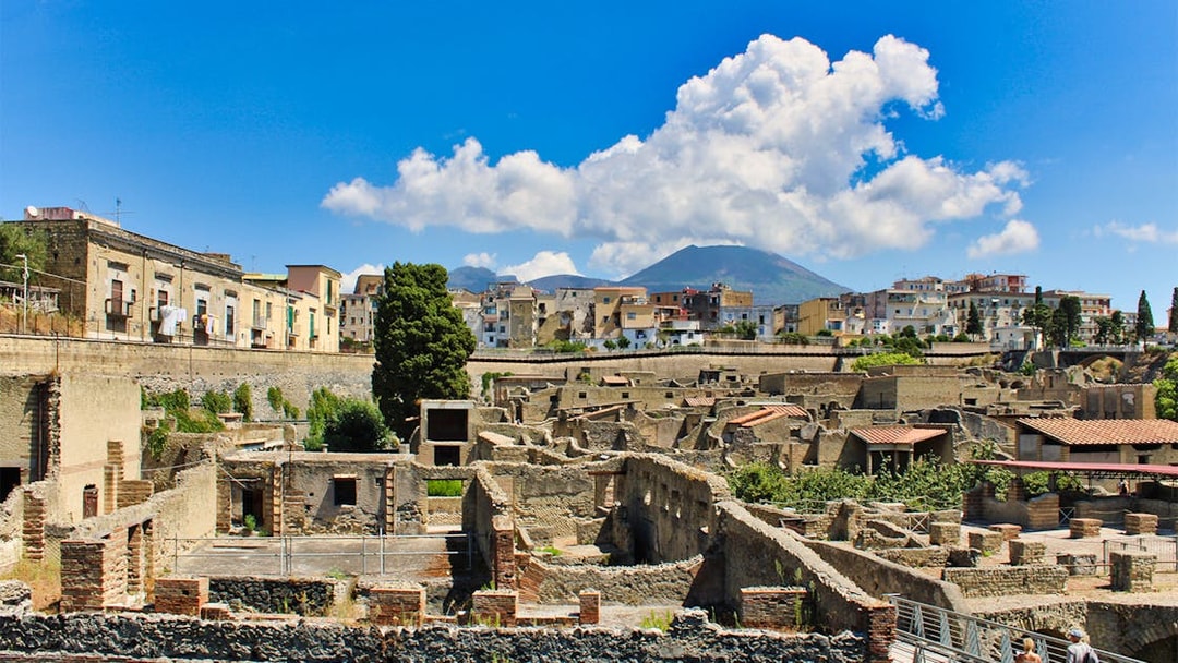 Aerial view of Herculaneum ruins with Mount Vesuvius in the background, Italy.