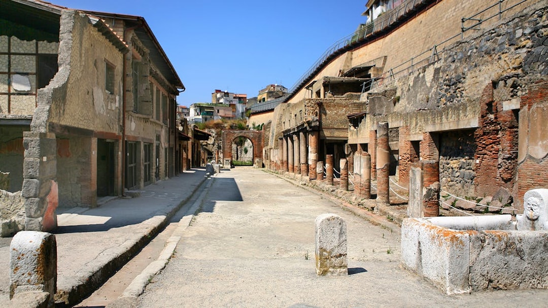 Ancient street with ruins and columns in Herculaneum, Italy.