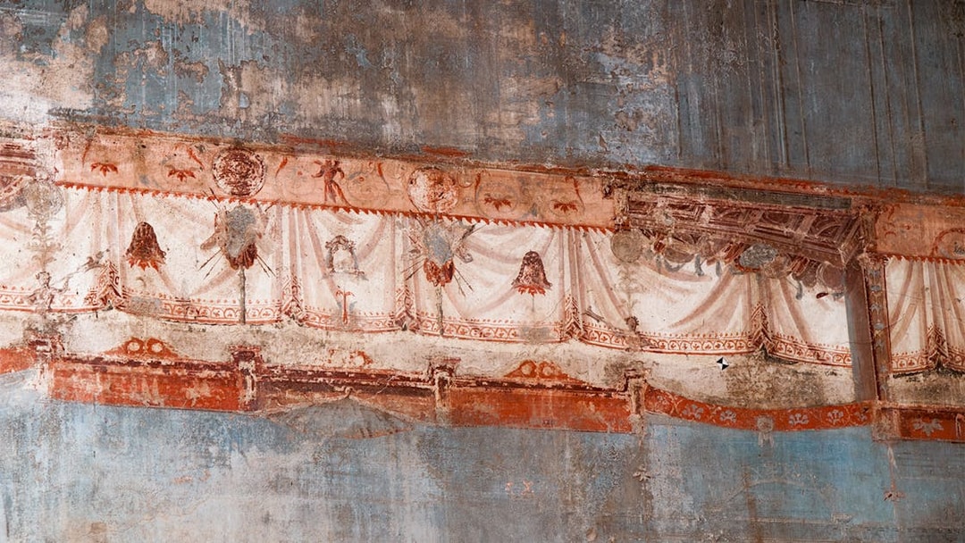Herculaneum frescoes with detailed red and white drapery patterns.