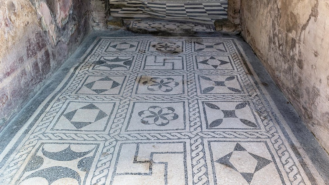 Herculaneum ancient floor frescoes with geometric patterns.