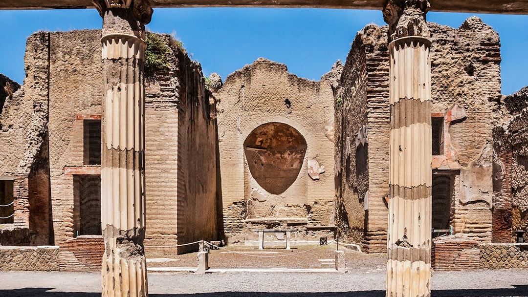 Ancient columns and walls at Herculaneum ruins in Italy.