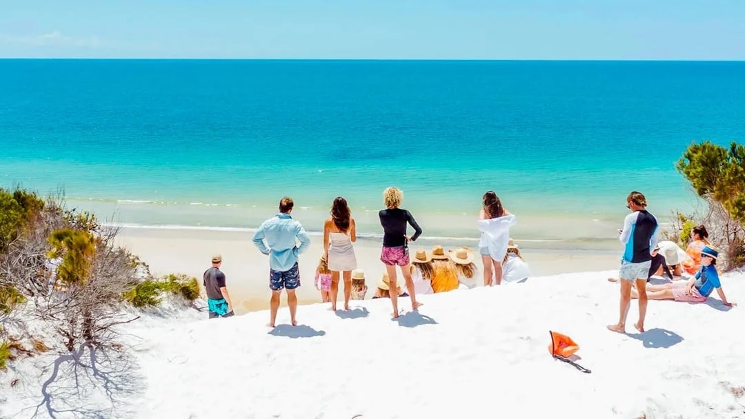 Tourists enjoying the beach view on Fraser Island, K'gari.