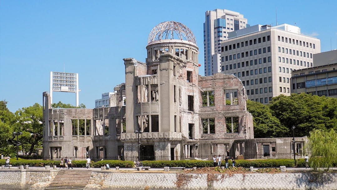 Hiroshima Peace Memorial with surrounding cityscape on sightseeing bus tour.
