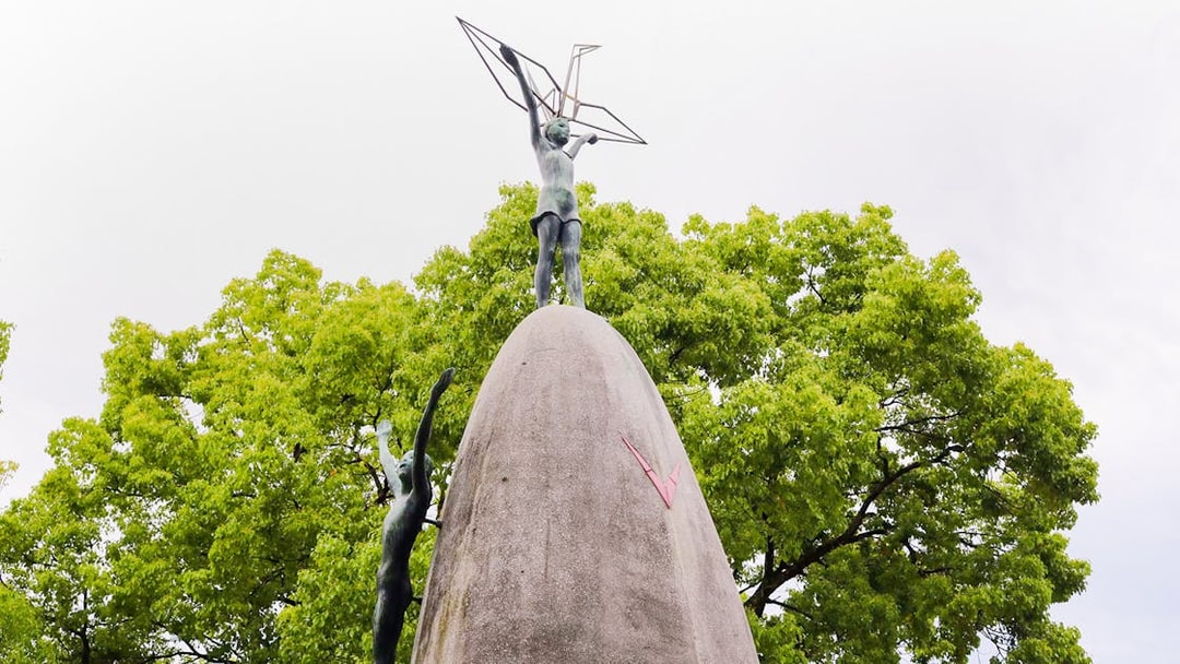 Children's Peace Monument with origami crane in Hiroshima's Peace Memorial Park.