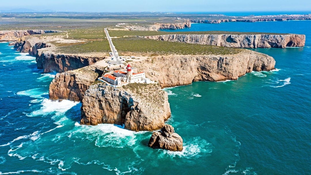 Lighthouse on cliffs at Cape St. Vincent, Western Algarve, Portugal.
