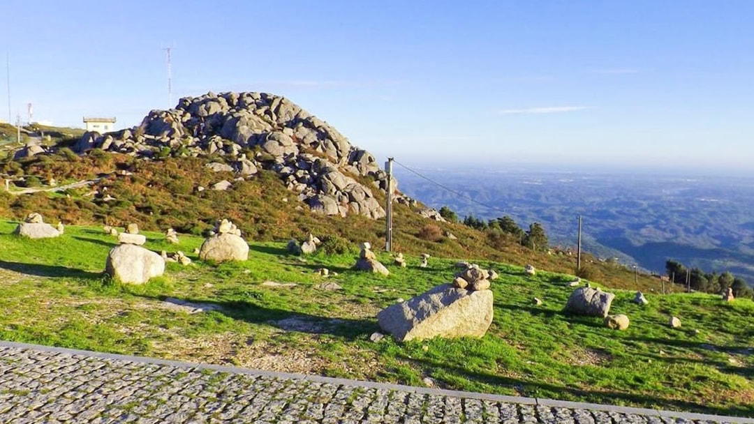 Rocky landscape with stone cairns on a hill in Western Algarve, Portugal.