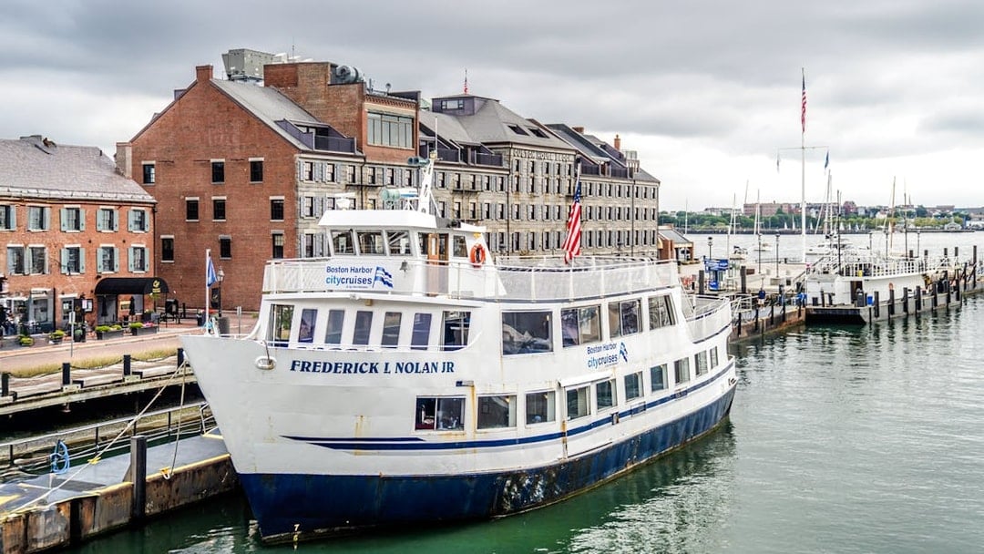 Frederick L Nolan Jr boat docked at Boston Harbor with historic buildings in the background