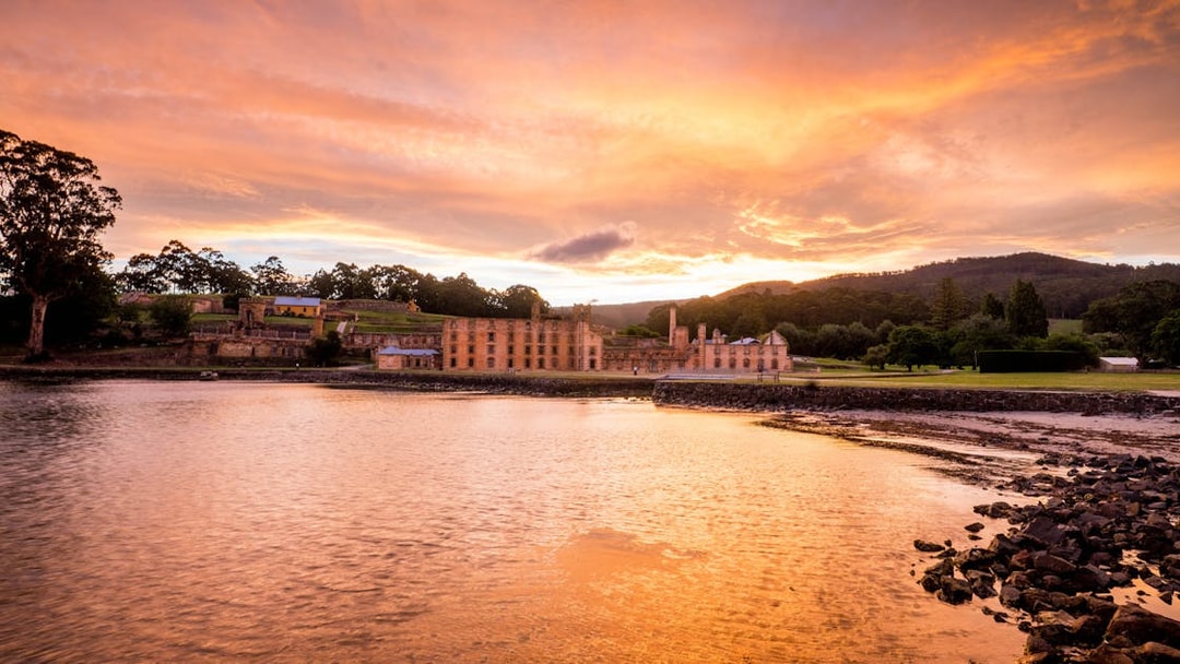 Port Arthur Historic Site at sunset, viewed from the water, Tasmania.